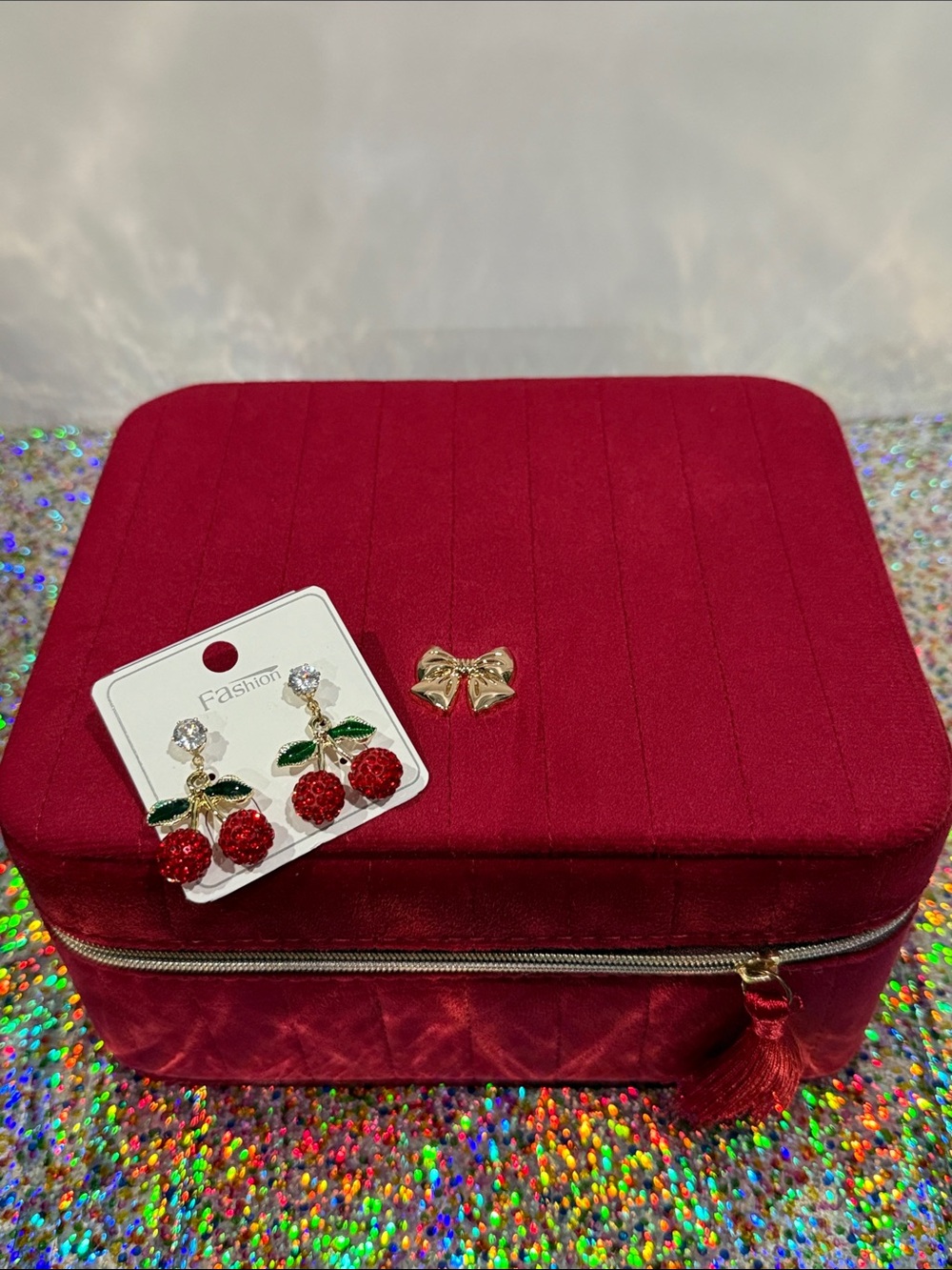 Red Quilted Women's Jewelry Case with Gold Bow Accent and Cherrie drop earrings.